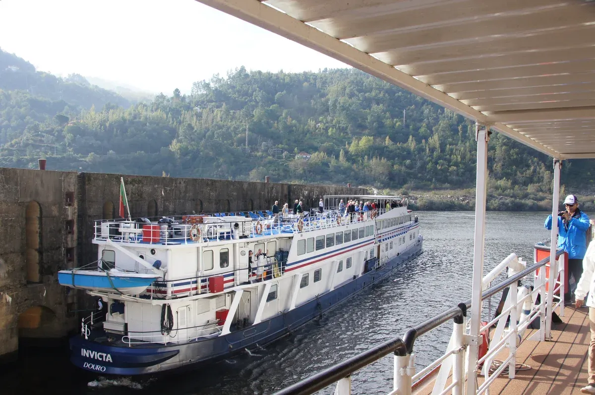 River cruise ship entering the Carrapatelo dam lock on the Douro on a Douro Valley wine tour from Porto